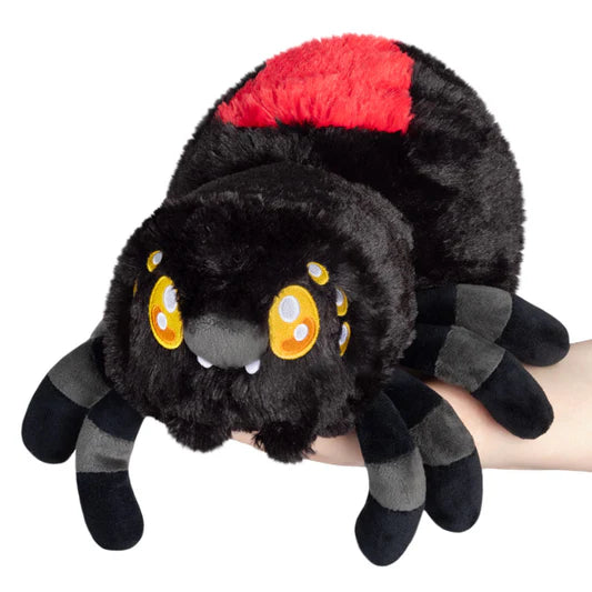 A plush resembling a cartoonish black widow spider, with large yellow embroidered eyes, on a white background.
