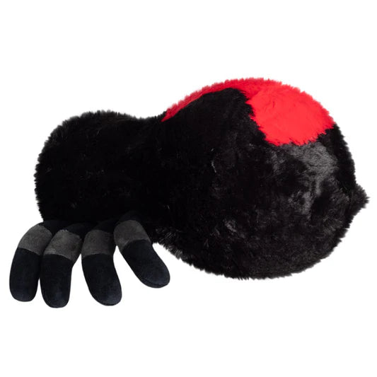 Plush toy resembling a spider with black body, red marking, and gray and black banded legs on a white background