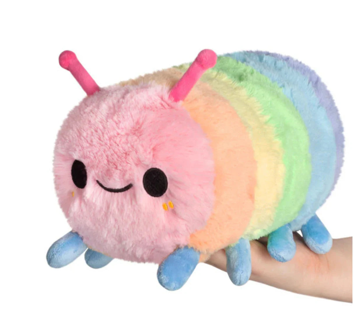 Plush toy caterpillar with rainbow segments on a white background