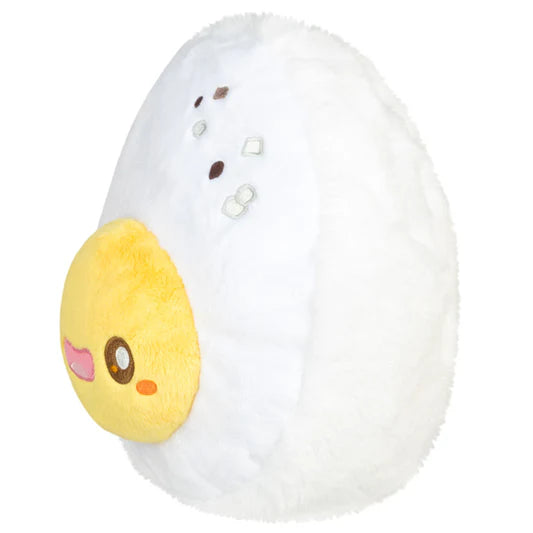 Plush toy resembling a cartoon-style boiled egg with a yellow yolk and facial features on a white background