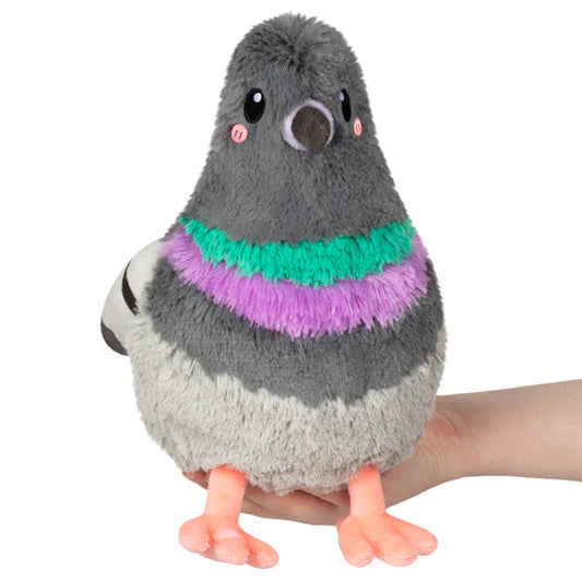 Plush toy pigeon with colorful chest on a white background