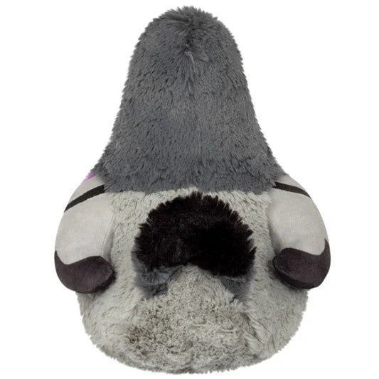 Back view of a grey plush pigeon showing its black tail.