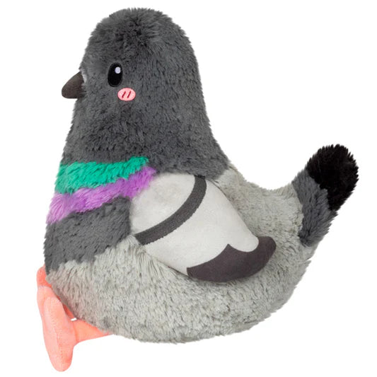 Side view of a plush toy pigeon with colorful chest on a white background
