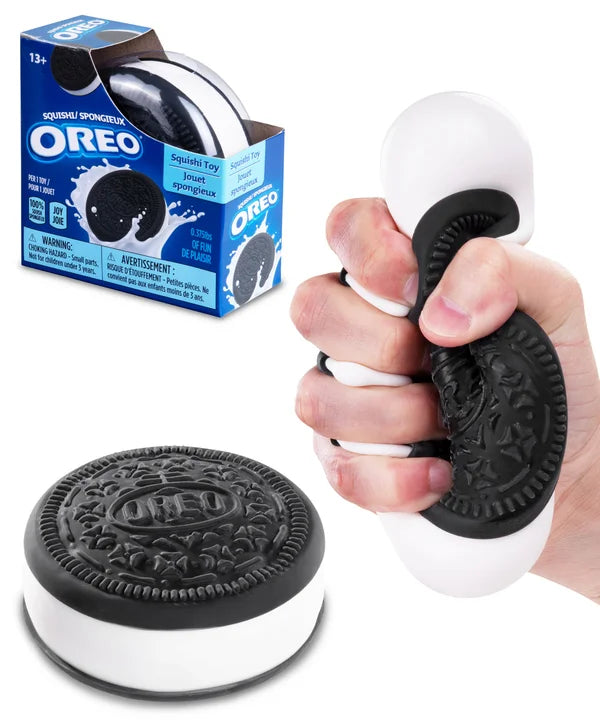 OREO branded squishy toy with packaging and a hand holding the toy.