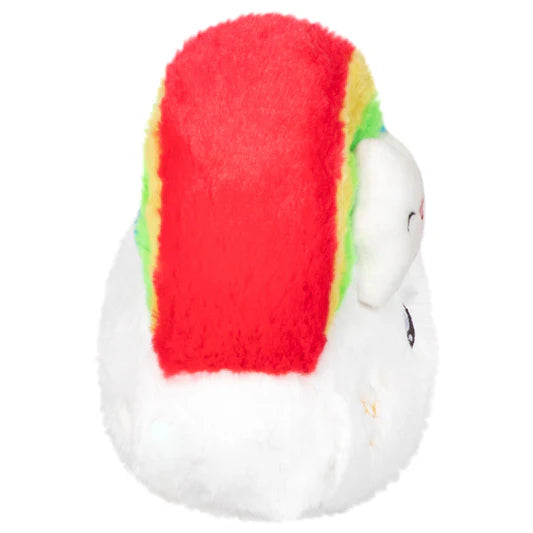Side view of a plush shaped like a cloud with a rainbow on it.